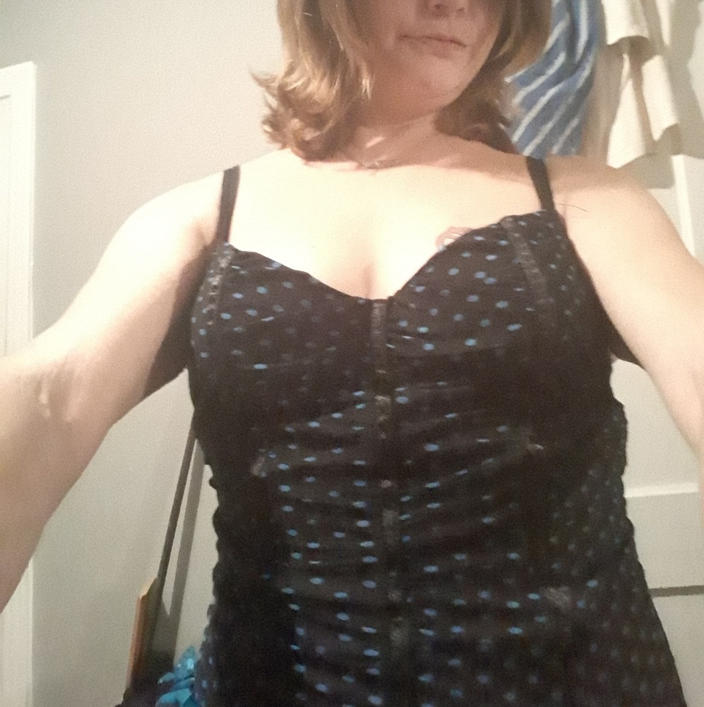 Two corsets a romper and a nike tshirt.